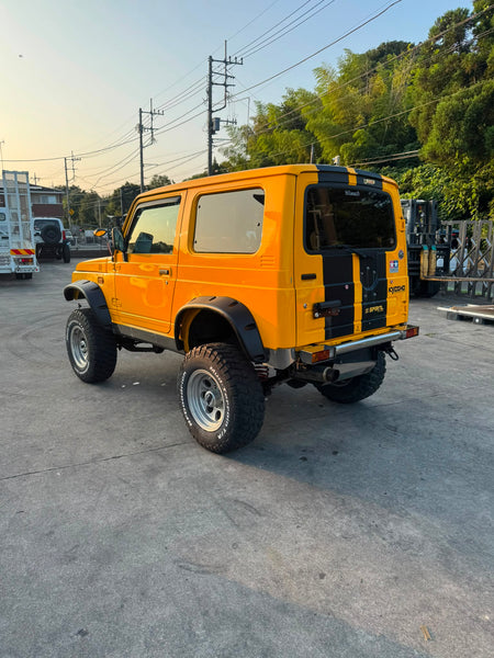 Yellow and black 1997 Suzuki Jimny Sierra 4x4 kei SUV, photo 4 of 11