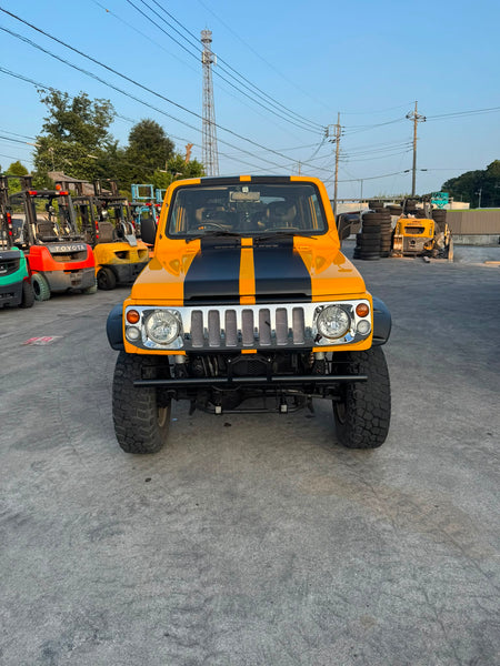 Yellow and black 1997 Suzuki Jimny Sierra 4x4 kei SUV, photo 2 of 11