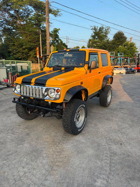Yellow and black 1997 Suzuki Jimny Sierra 4x4 kei SUV, photo 3 of 11
