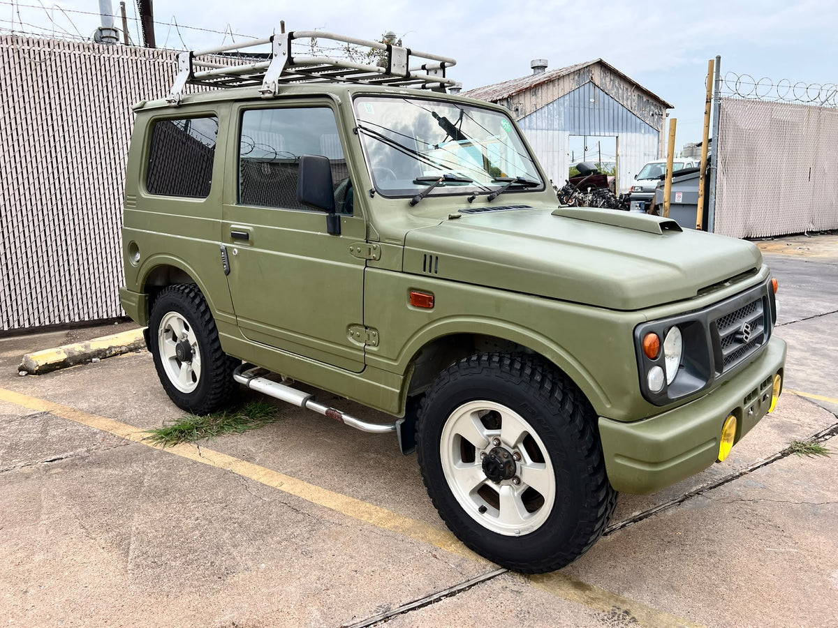 Green 1997 Suzuki Jimny 4x4 kei SUV