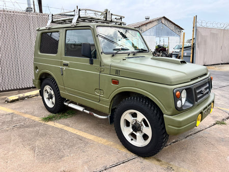 Green 1997 Suzuki Jimny 4x4 kei SUV